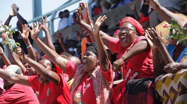 MDC’s Morgan Tsvangirai supporters sing and dance during Workers Day celebrations at Gwanzura stadium in Harare, Zimbabwe, (Tsvangirayi Mukwazhi, AP)