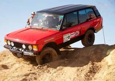 <b>UP AND OVER:</b> Heinz Kusel and Blanch Kusel drive their Range Rover during one of the challenges in Round 6 of the 2014 Bridgestone 4x4 Challenge at Rhino Park. <i>Image: Bridgestone</i>