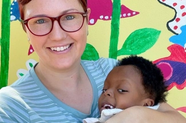 Tarryn Bell holds baby Sibusiso, who inspired her to start Butterfly Home. (PHOTO: Supplied)