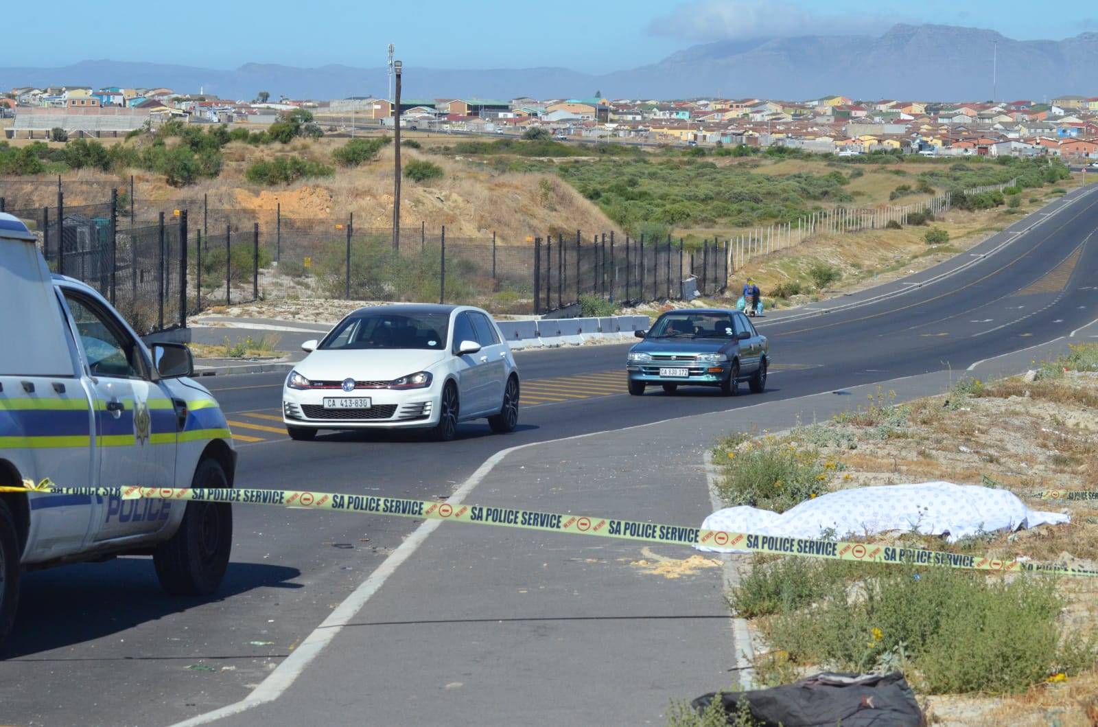 Lingelethu-West police are investigating a murder case after the body of an unidentified man was found on 30-01-2022 in Spine Road, on the side of the road in Khayelitsha, Cape Town..Photo by Lulekwa Mbadamane