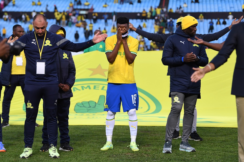 Mamelodi Sundowns  captain Themba Zwane looks dejected with teammates.