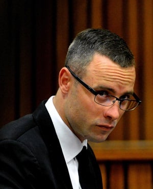 Oscar Pistorius sits in the dock during his ongoing murder trial in Pretoria. (Thobile Mathonsi, AFP)