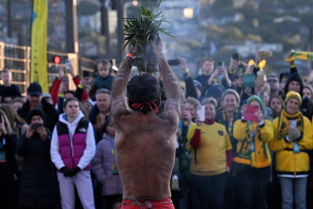 Indigenous cultural performers perform a smoking ceremony during the "Unity Celebrations", an event marking the 25-day countdown until the start of the Australia and New Zealand FIFA Women's World Cup 2023, on the Sydney Harbour Bridge in Sydney on June 25, 2023.