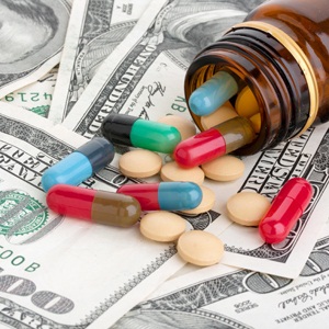 Pills and American dollars from Shutterstock