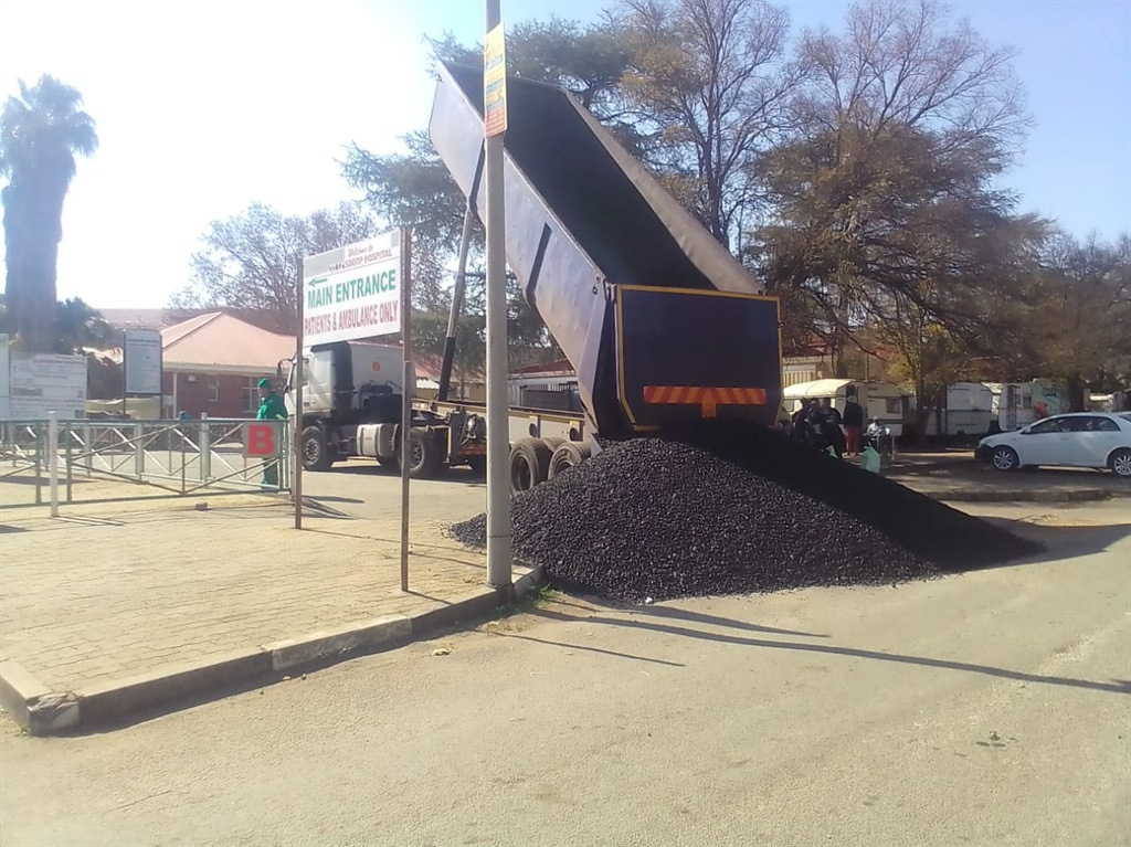 A coal service provider truck at the main entrance