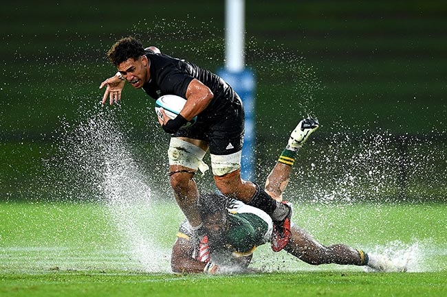 New Zealand's Malachi Wrampling-Alec is tackled during the Rugby Championship U20 match against South Africa at Sunshine Coast Stadium on 2 May 2024. (Albert Perez/Getty Images)