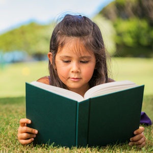 A child reading from Shutterstock.