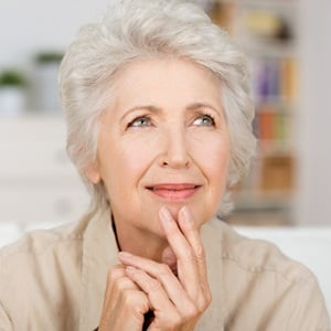 Thoughtful senior lady from Shutterstock