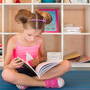 Girl reading from Shutterstock. 