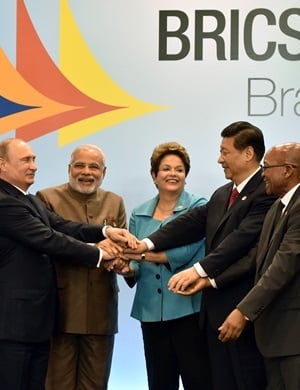 (L to R) Russia's President Vladimir Putin, India's Prime Minister Narendra Modi, Brazilian President Dilma Rousseff, China's President Xi Jinping and South Africa's President Jacob Zuma join their hands during Brics summit in Fortaleza, Brazil. (Nel