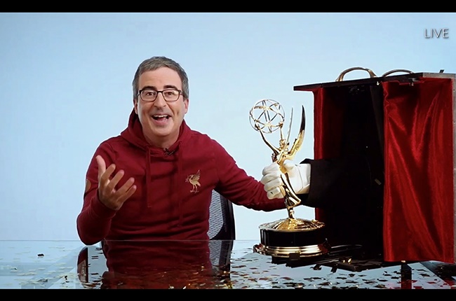 Talk show host John Oliver as he wins the Emmy for