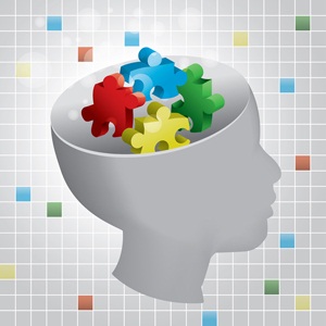 Profiled head of a child with symbolic autism puzzle pieces from Shutterstock