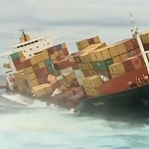 A cargo ship about to lose its containers to rough seas. Credit: Youtube