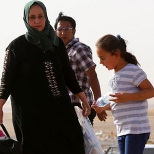 Iraqi women flee Mosul. Reuters image