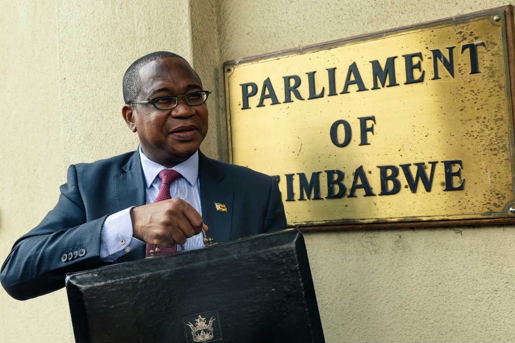 Zimbabwe Finance Minister Mthuli Ncube arrives at the Parliament of Zimbabwe to present the national annual budget on 14 November 2019.