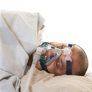 Man suffering from sleep apnoea from Shutterstock