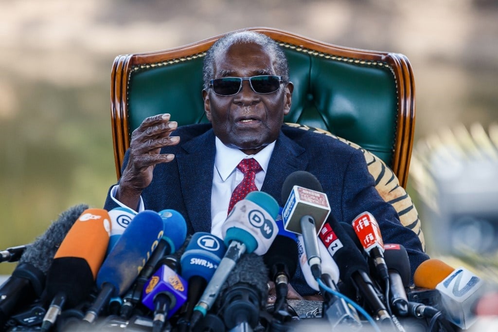 In this file photo taken on July 29, 2018, former Zimbabwean President Robert Mugabe addresses media during a surprise press conference at his residence "Blue Roof " in Harare, on the eve of the country's first election since he was ousted from office.