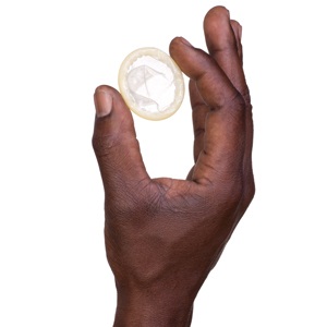 Hand with condom from Shutterstock
