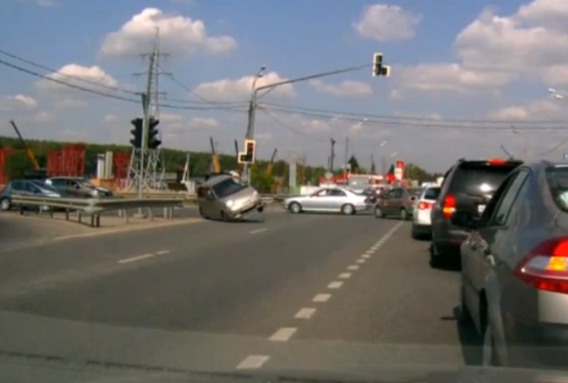 <b>FLIP! </b> This silver hatchback seen hurtling down a road after an impromptu pit manoeuvre. <i> Image: YouTube </i> 