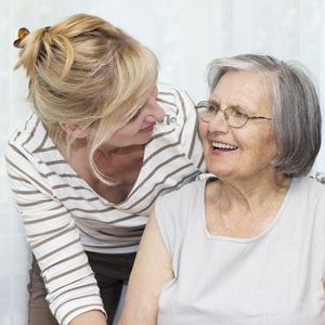 Mature woman embracing her senior mother from Shutterstock