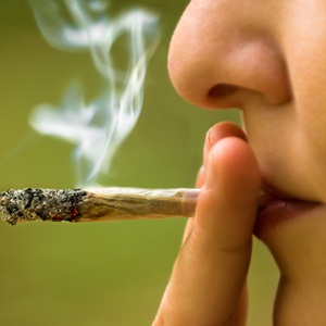Girl smoking marijuana from Shutterstock