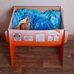 World Vision and HOLO distributed cardboard cots to fight neonatal mortality.