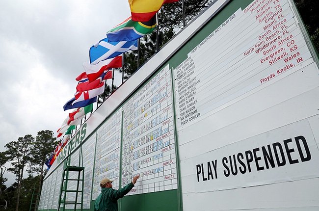 Signage that reads Play Suspended due to weather on the leaderboard during the second round of the 2023 Masters Tournament at Augusta National Golf Club. (Photo by Andrew Redington / GETTY IMAGES NORTH AMERICA / Getty Images via AFP)