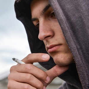 Teenage boy smoking from Shutterstock