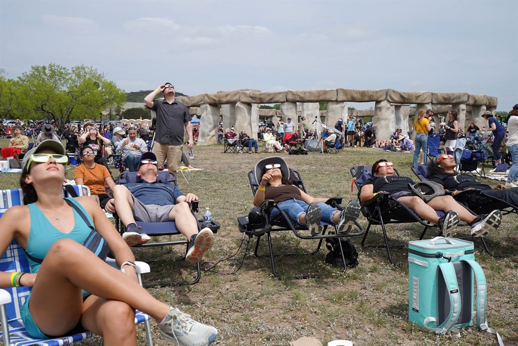 People gather to watch a total solar eclipse across North America, at Stonehenge II at the Hill Country Arts Foundation in Ingram, Texas, on 8 April 2024. This year's path of totality is 185 kilometres wide and home to nearly 32 million Americans, with an additional 150 million living less than 200 miles from the strip. The next total solar eclipse that can be seen from a large part of North America won't come around until 2044.
(Cécile Clocheret / AFP)