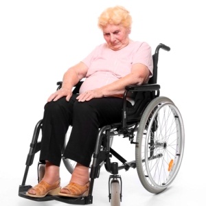 Woman asleep in wheelchair from Shutterstock