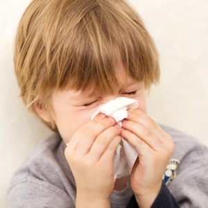 Child sneezing from Shutterstock
