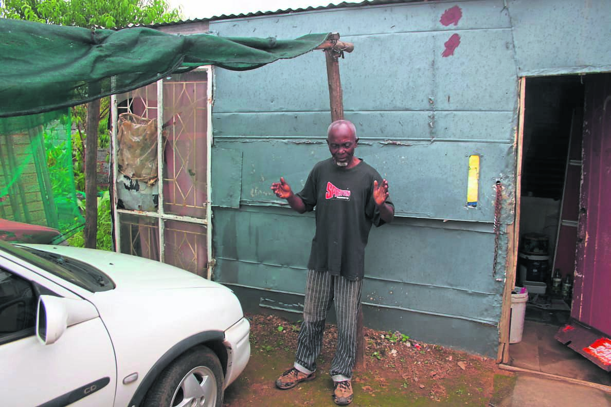 Madala Joseph Mashigo outside his rented shack in Zenzele, Daveyton.            Photo by Phineas Khoza