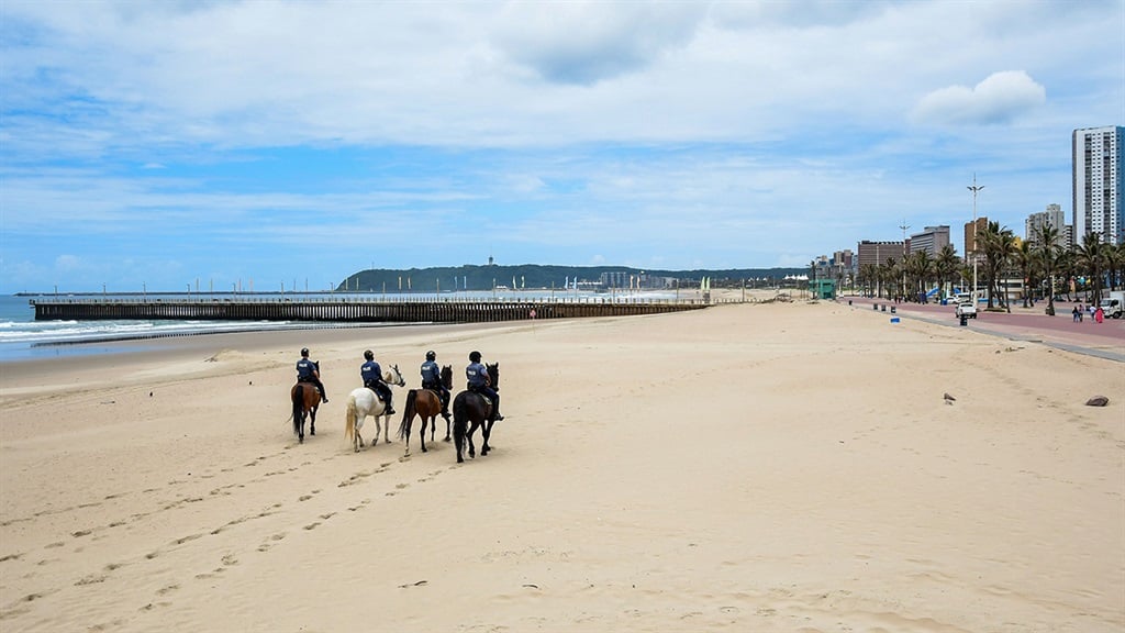 Mounted police during beach closures on December 16, 2020 in Durban, South Africa.  (Photo by Darren Stewart/Gallo Images via Getty Images)
