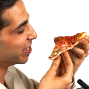Man eating pizza from Shutterstock
