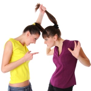 Two young women fighting from Shutterstock