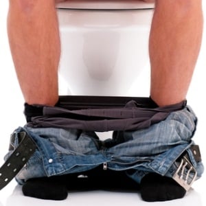 Man on toilet from Shutterstock