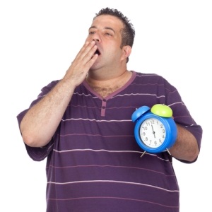 Yawning fat man from Shutterstock