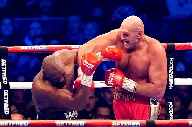 Tyson Fury (right) in action against Derek Chisora. (Photo by Zac Goodwin/PA Images via Getty Images)