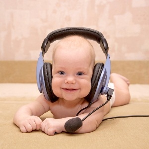 Baby wearing a headset from Shutterstock
