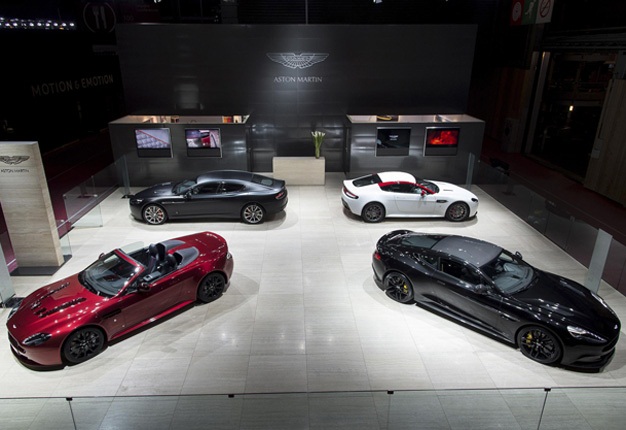 <b>ON SHOW:</b> Aston Martin's stand at the 2014 Paris auto show features the V12 Vantage S Roadster (front left) , the hot Vanquish Coupe Carbon Black (front right), Rapide S (back left) and V8 Vantage N430 (back right). <i> Image: Aston Martin</i>
