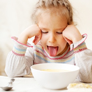 Child looks with disgust for food from Shutterstock