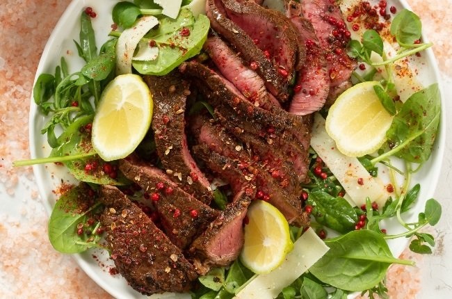 Pink peppercorn steak with herb salad