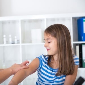 Girl receiving vaccination from Shutterstock