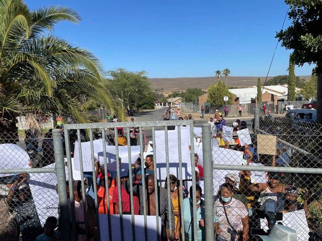 Angry community members protest outside the Magistrate's Court
Photo:
Marvin Charles