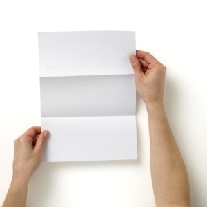 Hands holding a letter from Shutterstock