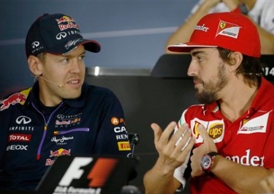 <b>VETTEL'S TEAM SWITCH:</b> Sebastian Vettel (left) announced he will leave Red Bull for Ferrari in 2015. Ferrari ace Fernando Alonso's future however remains in doubt.<i>Image: AP/ Luca Bruno</i>