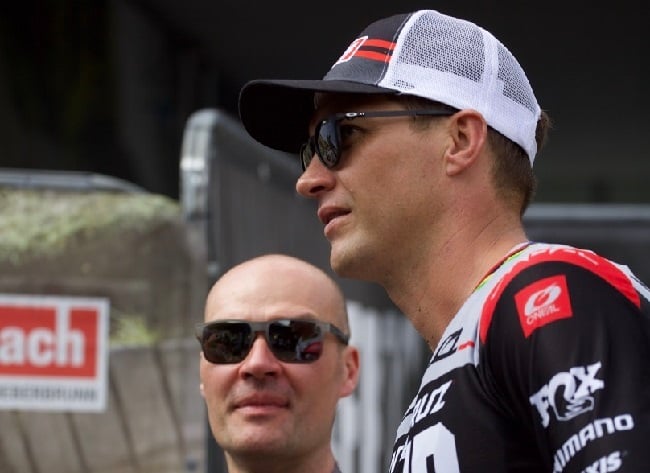 Alan Milway with Greg Minnaar, discussing strategy at a UCI World Cup downhill event. (Photo: Kathy Sessler)