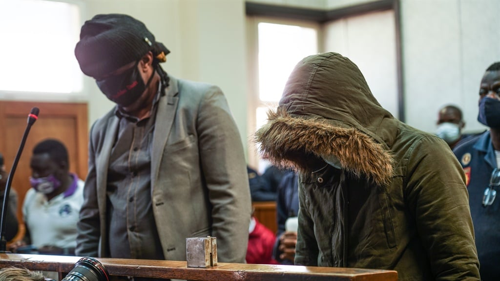 Police officers Simon Scorpion Ndyalvana (left) and Caylene Whiteboy (right) appeared in the Protea Magistrate court in Soweto on Monday following the killing of Nathaniel Julies. 