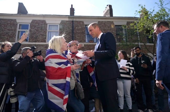 William, Prince of Wales, greets well-wishers outside James' Place, a mental health centre for men, in Newcastle. (PHOTO: Gallo Images/Getty Images) 