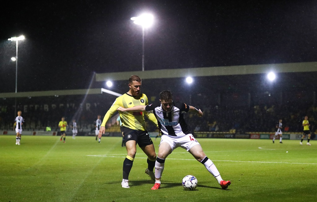 HARROGATE, ENGLAND - OCTOBER 05: Bradley Cross of Newcastle United holds off George Thomson of Harrogate Town during the Papa Johns EFL Trophy Group match between Harrogate Town and Newcastle United U21s at The EnviroVent Stadium on October 05, 2021 in Harrogate, England. (Photo by George Wood/Getty Images)